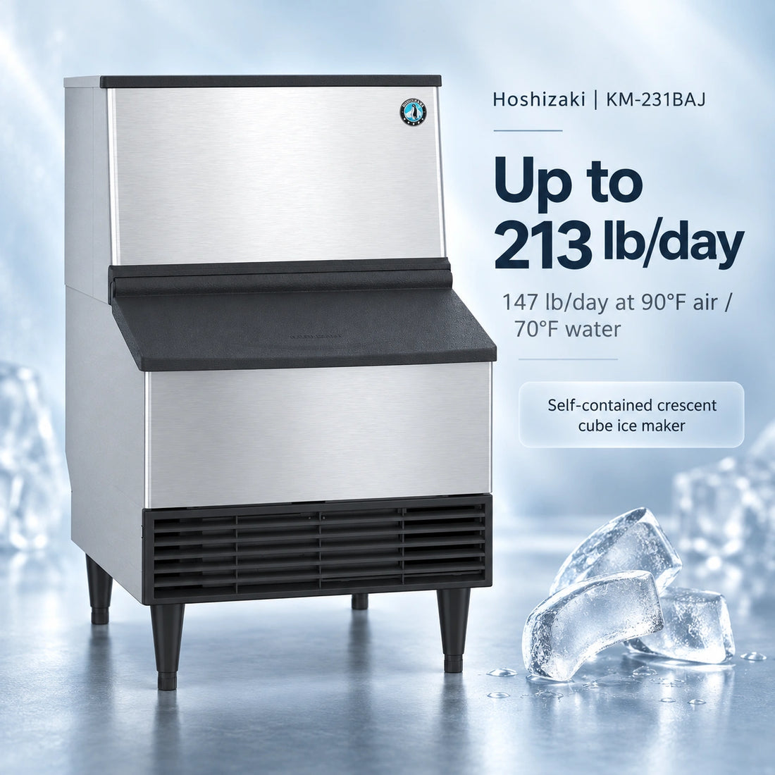 A commercial ice machine with a brushed stainless steel body, black top and front apron, black legs, and a small circular blue logo badge on the upper right front panel, shown on a plain white background.