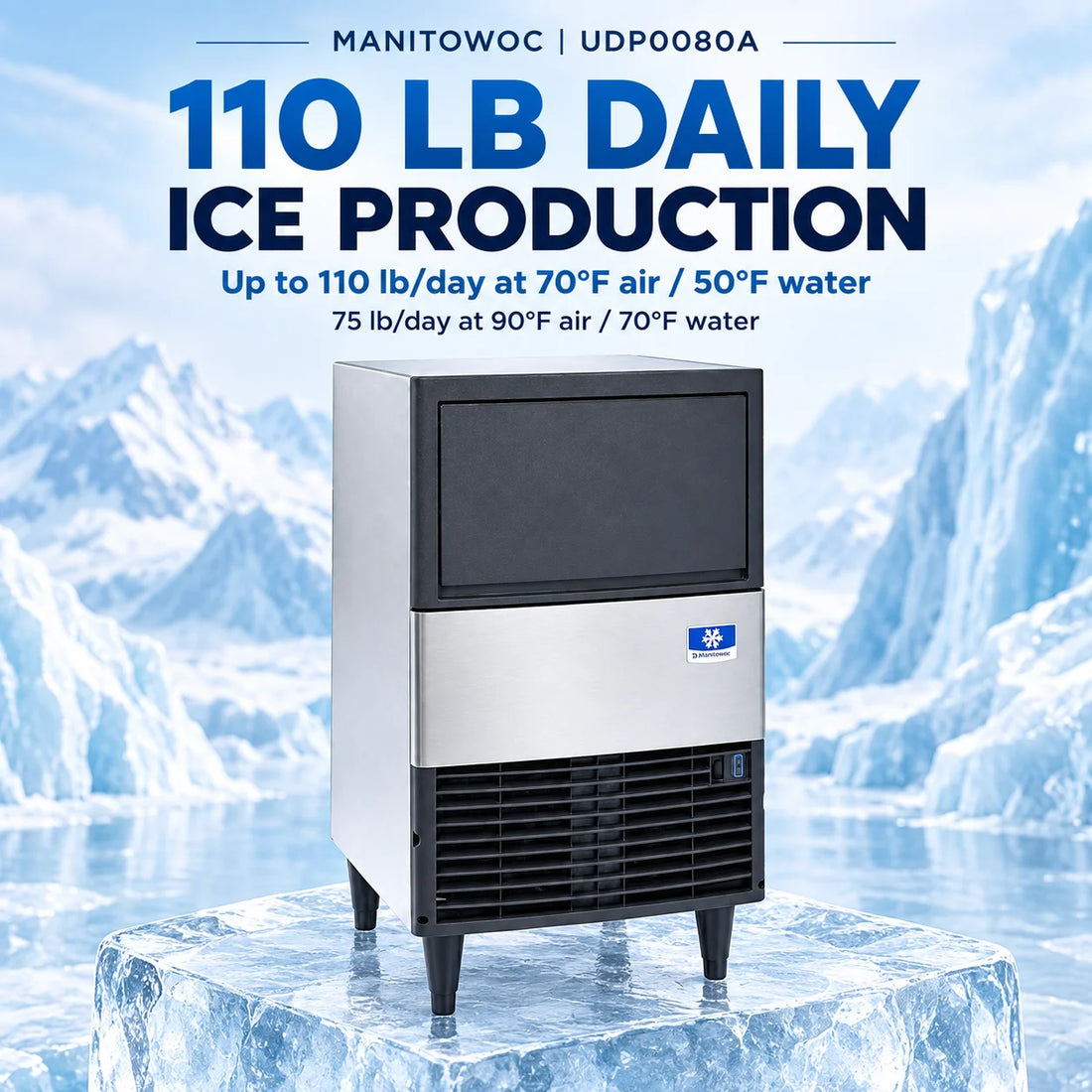 A commercial ice machine with a stainless steel body, black top and lower grille sections, and black legs, featuring a blue and white Emerson logo on the front.