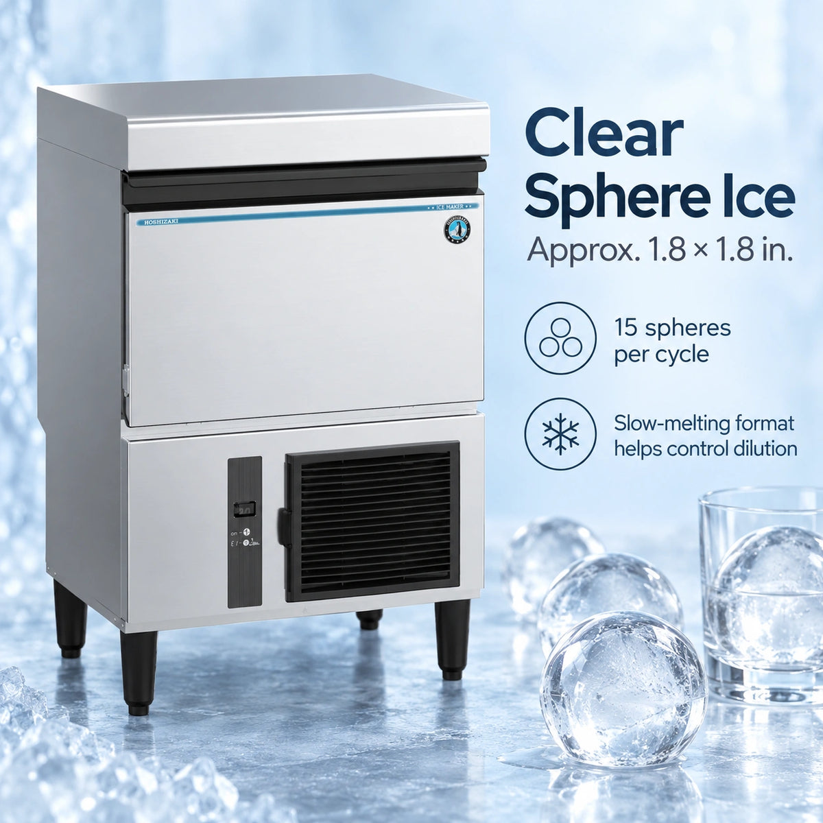 A stainless steel commercial ice machine shown on a icy blue background with text callouts about clear sphere ice and icons noting 15 spheres per cycle and slow-melting format. Ice cubes and glasses are placed around it as props.