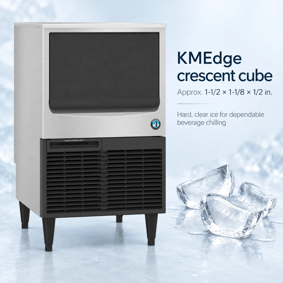 A KMEdge crescent cube ice machine shown on a light icy studio background with text describing the crescent cube size and a small cluster of clear ice cubes at the lower right.