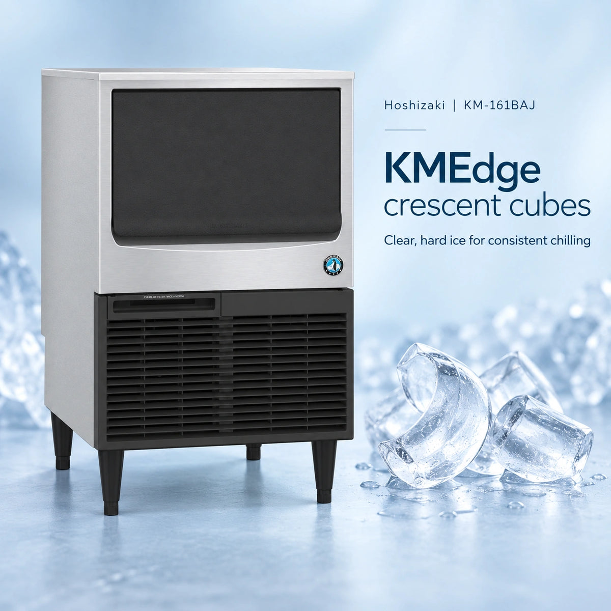 A Hoshizaki KMEdge crescent ice machine with a stainless steel top and black lower grille, shown on a light blue icy background with ice cubes and product text.
