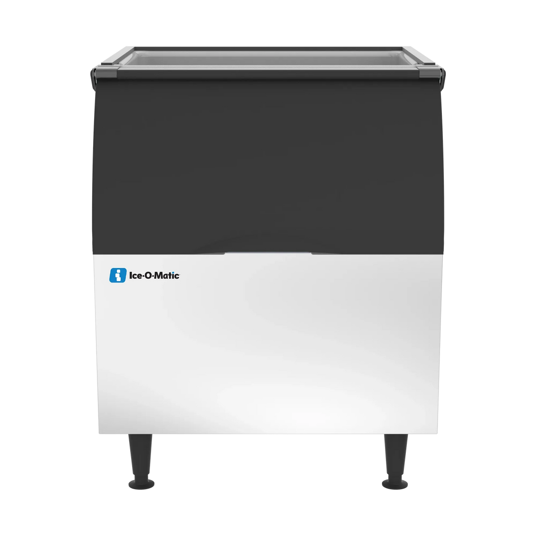An Ice-O-Matic commercial ice machine with a black upper section and a white lower section, standing on black legs against a plain white background.