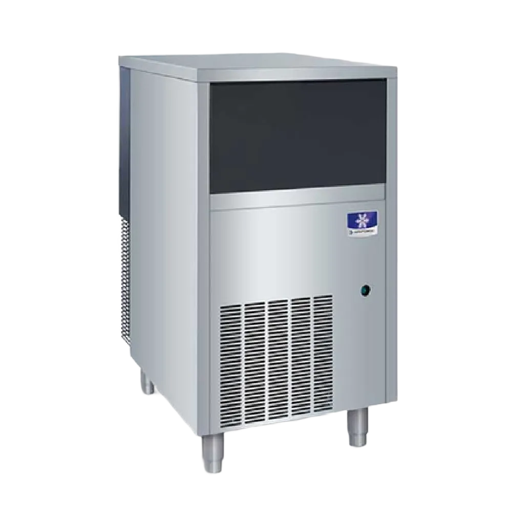 A stainless steel commercial ice machine with a dark front panel, vented lower section, and a small blue-and-white logo badge on the upper right front.